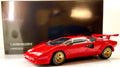 Lamborghini Countach LP 5000 Quattrovalvole Kyosho 08320RBKG rossa con cerchi oro, vista anteriore di tre quarti con scatola.